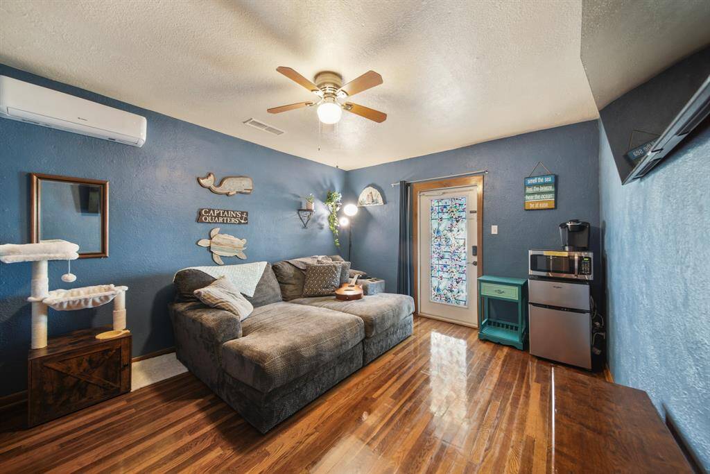 Bedroom 2 also features a door that leads to the porch, currently utilized for access in a short-term rental setting