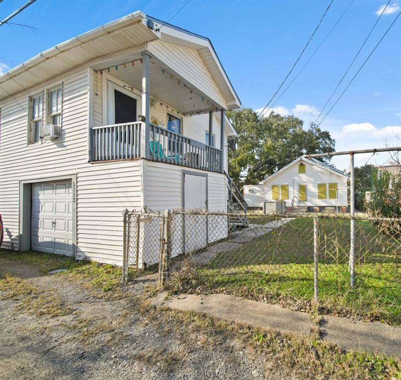 The garage unit has its own separate entrance. This is the alley side of the garage apartment. The tenant of the garage uses the garage below.