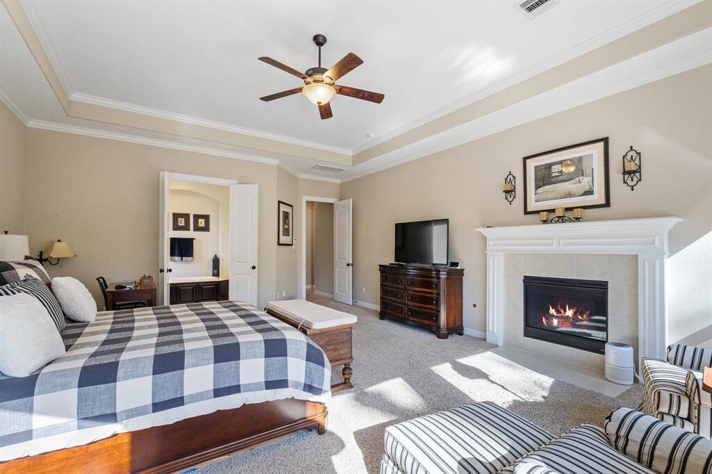 Double doors provide elegant access to the spa-like bathroom, offering both privacy and convenience. With its tranquil atmosphere, the Primary Bedroom is designed for relaxation, blending comfort and luxury to create a peaceful haven within the home.