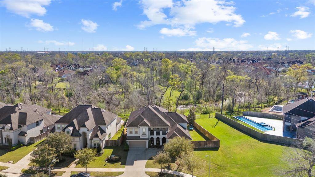 Amazing aerial view of this two-story gem in the highly desirable gated section of Avalon at Riverstone. Nestled on a peaceful corner lot with no back neighbors, this home boasts serene views of the wooded landscaping —offering the perfect blend of tranquility and convenience. A rare opportunity in an exclusive neighborhood!