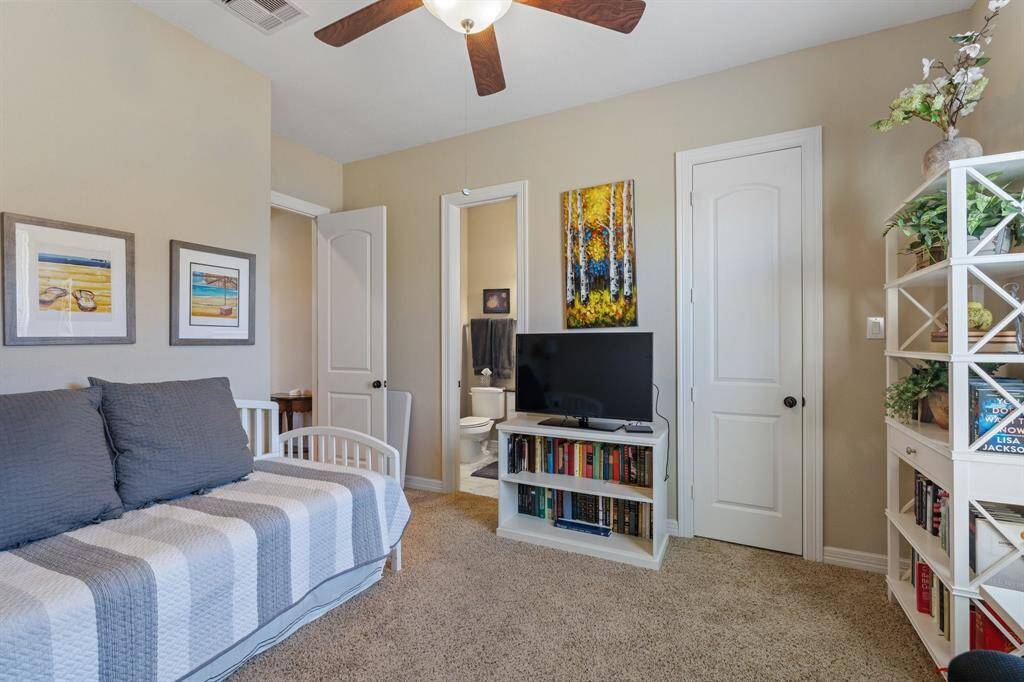 Additional view of the guest suite, offering privacy with an ensuite bathroom. This cozy retreat is perfect for multi-generational living or guests.