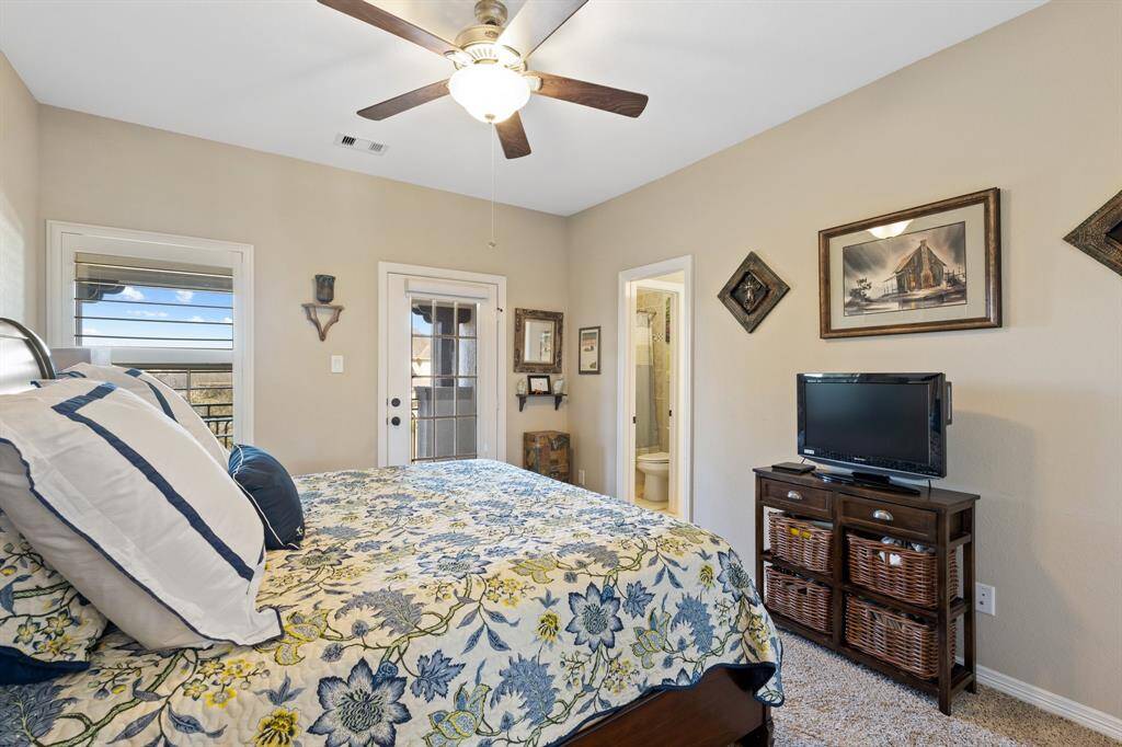 Cozy secondary bedroom offers both comfort and privacy, with direct access to a private balcony, perfect for enjoying fresh air and views. The room is complete with its own ensuite bathroom, providing added convenience and luxury.