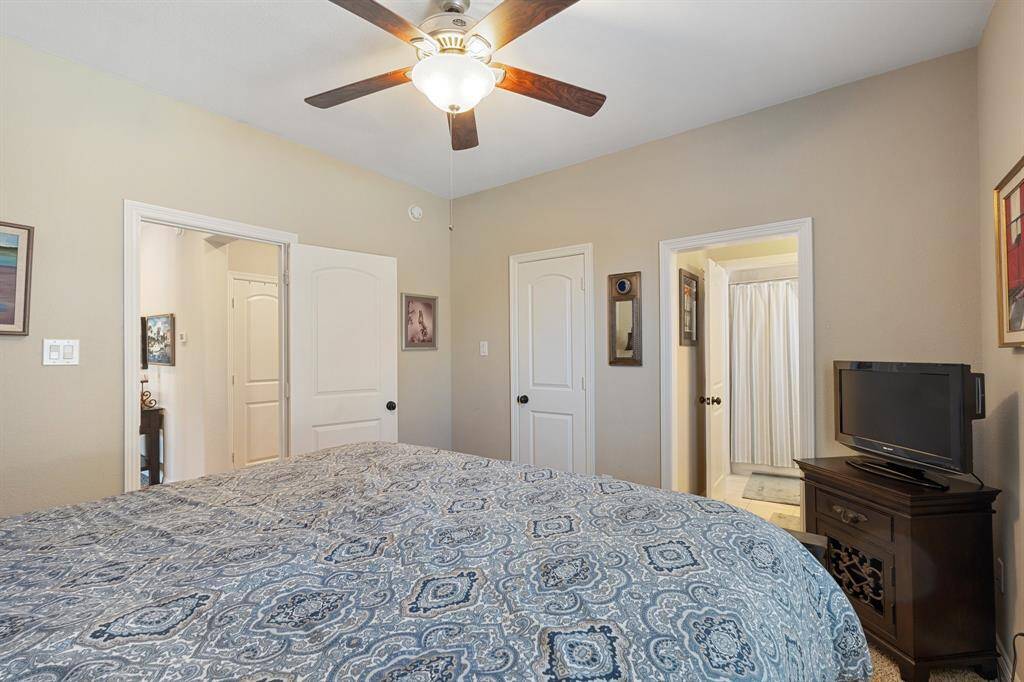 Another view of the secondary bedroom, showcasing neutral finishes, creating a cozy and welcoming environment.