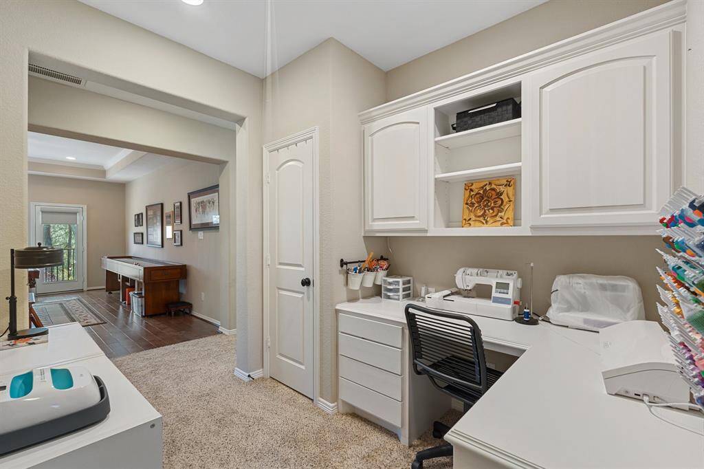 The functional layout ensures everything is neatly stored and easily accessible, creating an efficient area that blends practicality with style. Whether you need a quiet workspace or a place to keep things organized, this area is ideal for a variety of uses.