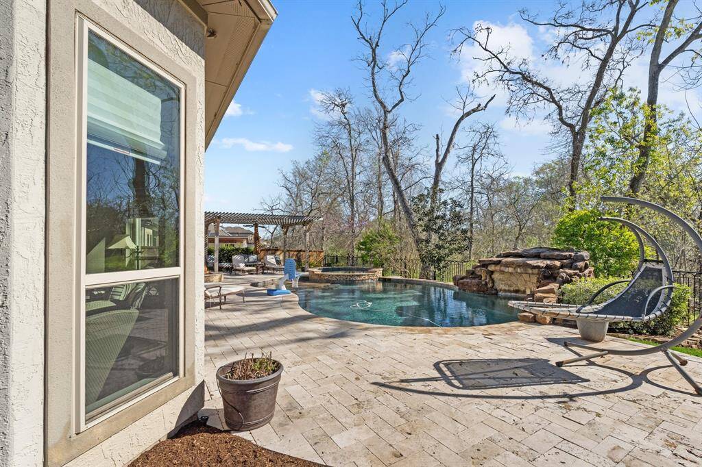 Whether you're lounging by the water or enjoying the cool shade under the pergola, this area offers a peaceful retreat for both relaxation and entertainment.