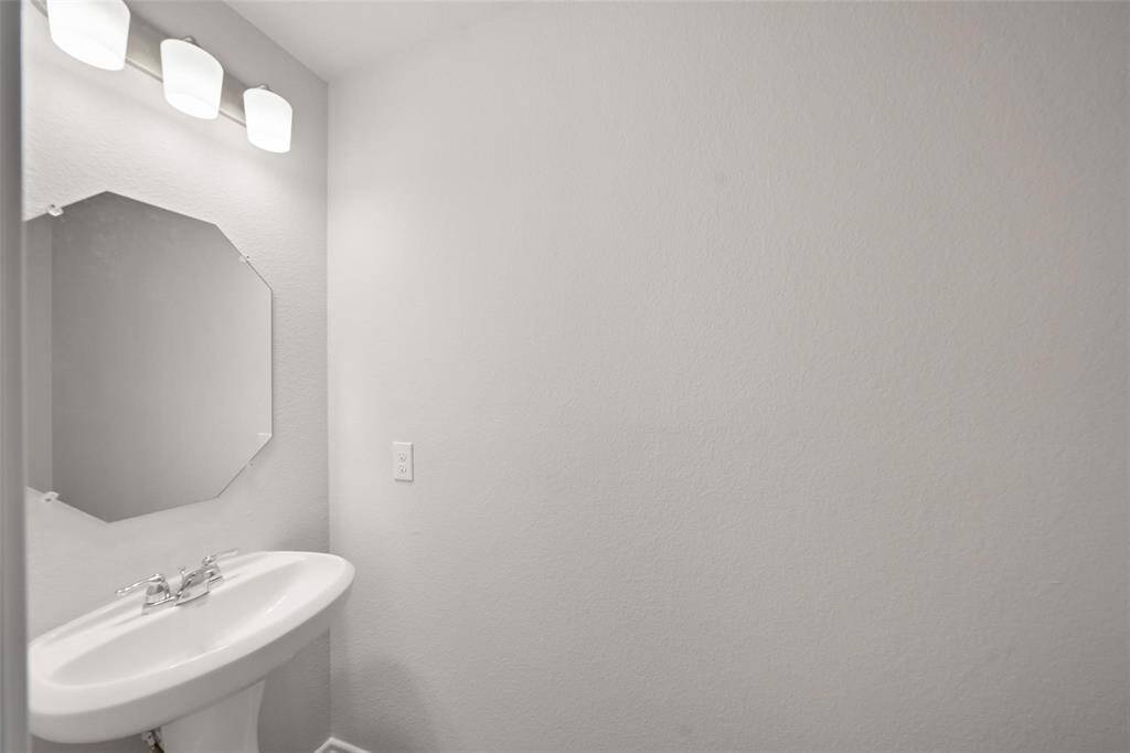 Enjoy a great view right from the kitchen sink, overlooking the beautiful backyard.