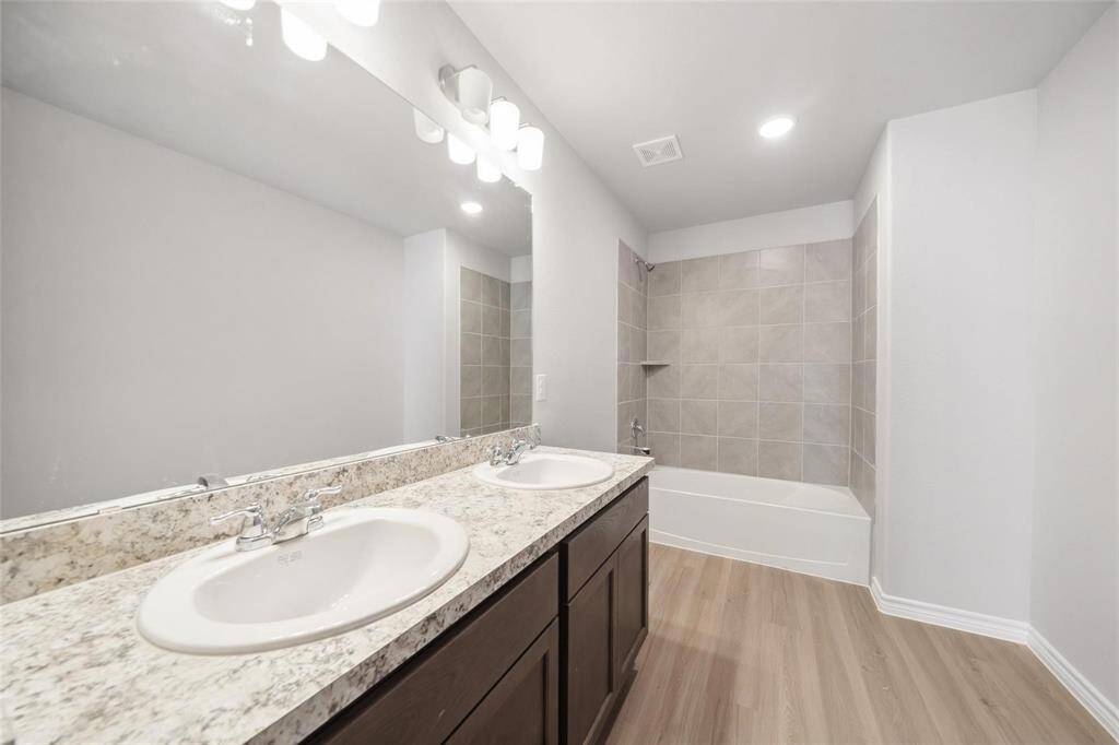 The third bedroom is versatile and could easily serve as either an office or a bedroom.