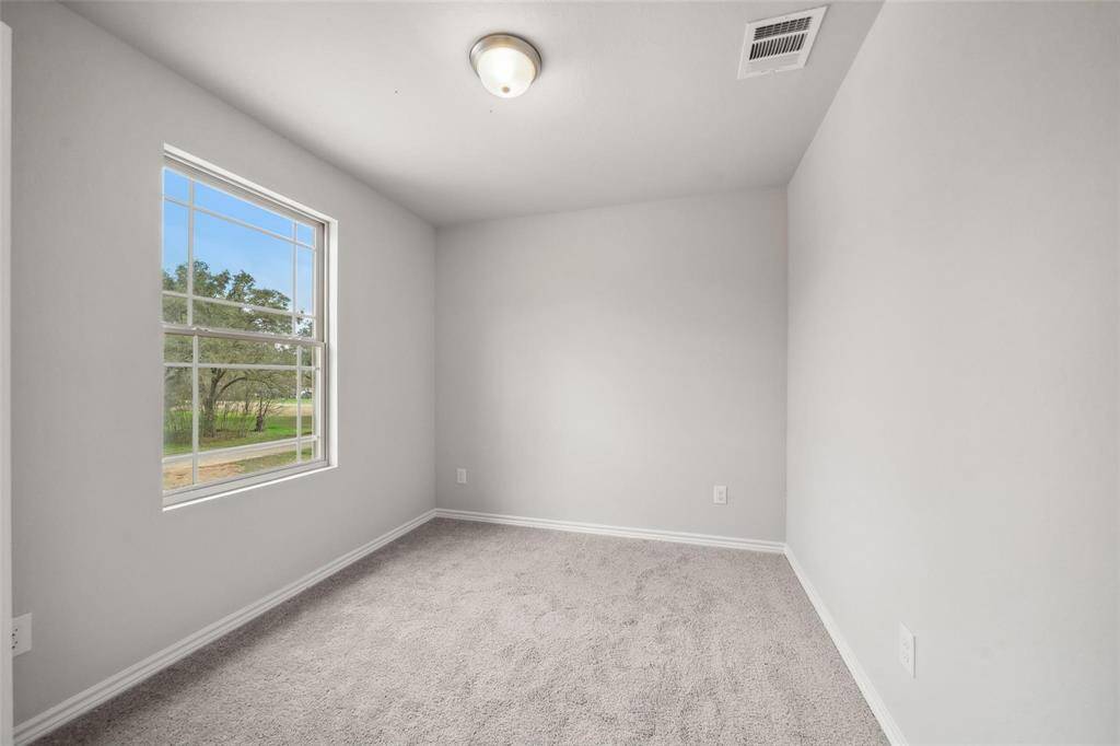 The second bathroom features a large vanity, abundant lighting, and another generously sized shower/tub combo!