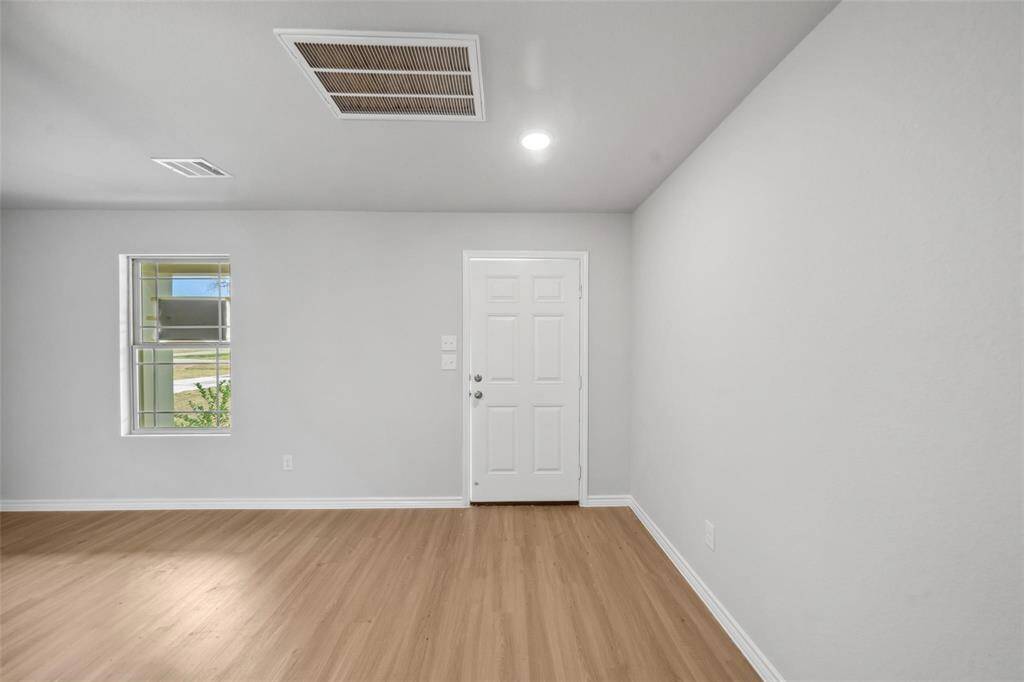 Take another look at this outstanding space, highlighted by beautiful light wood flooring that adds warmth and style.