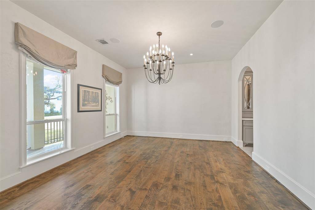 The formal dining room is large enough to host a dinner party of 12 or more and still leave room for additional furnishings.
