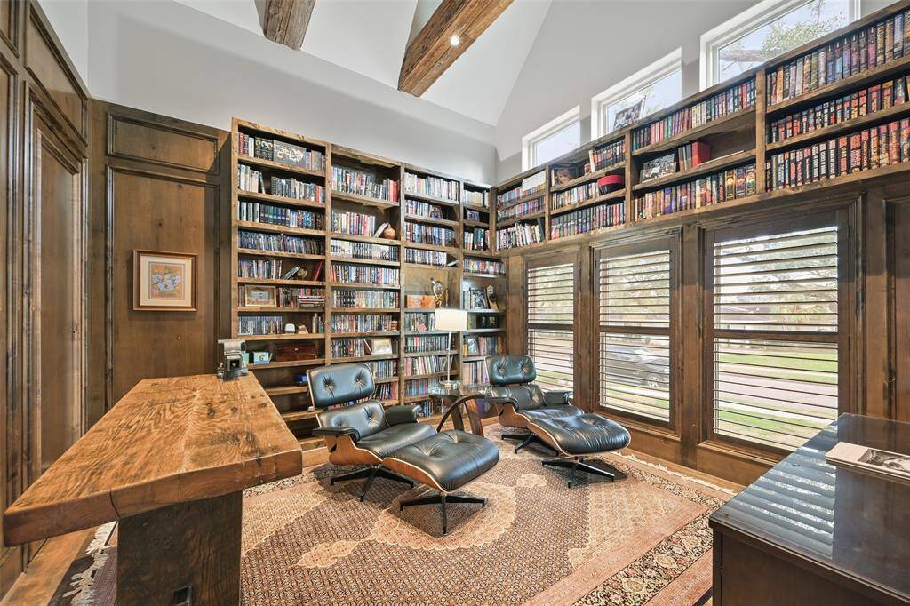 The study/library is a great place to relax and get away to read a book or work quietly. Beamed cathedral ceiling and wood panel walls accent the space.