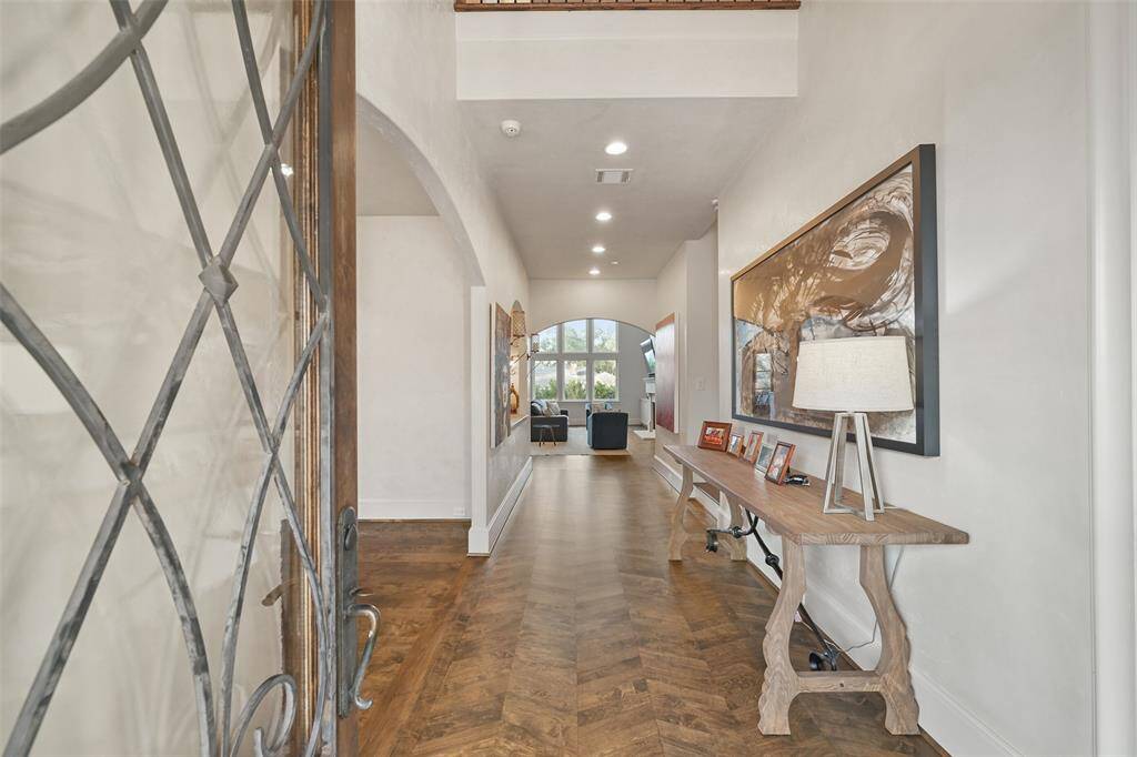 Wood floors are featured throughout the home. The two story entry leads to the great room with access to the formal dining room to the left and the study to the right.