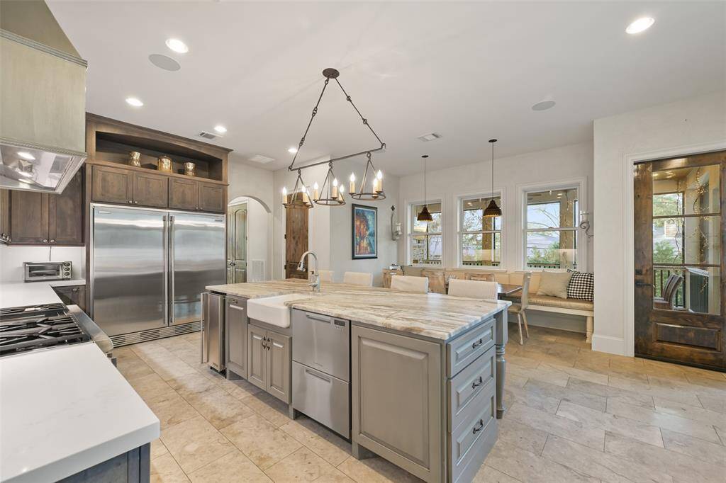 Another view of the large kitchen with side by side built-in refrigerator and freezer.