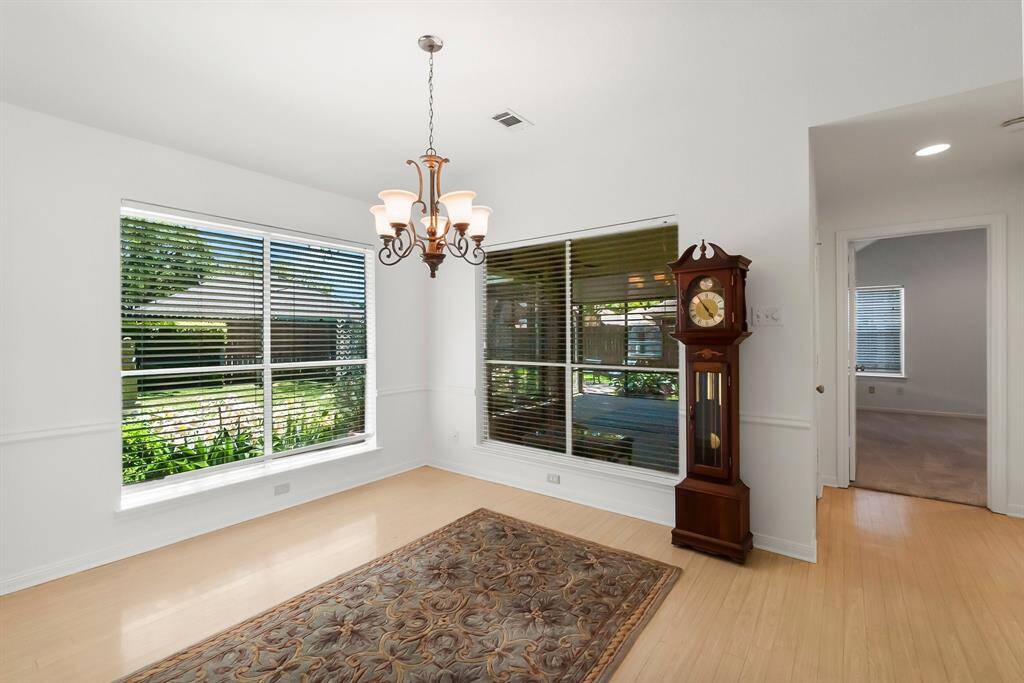 Open dining room with views to back yard and porch