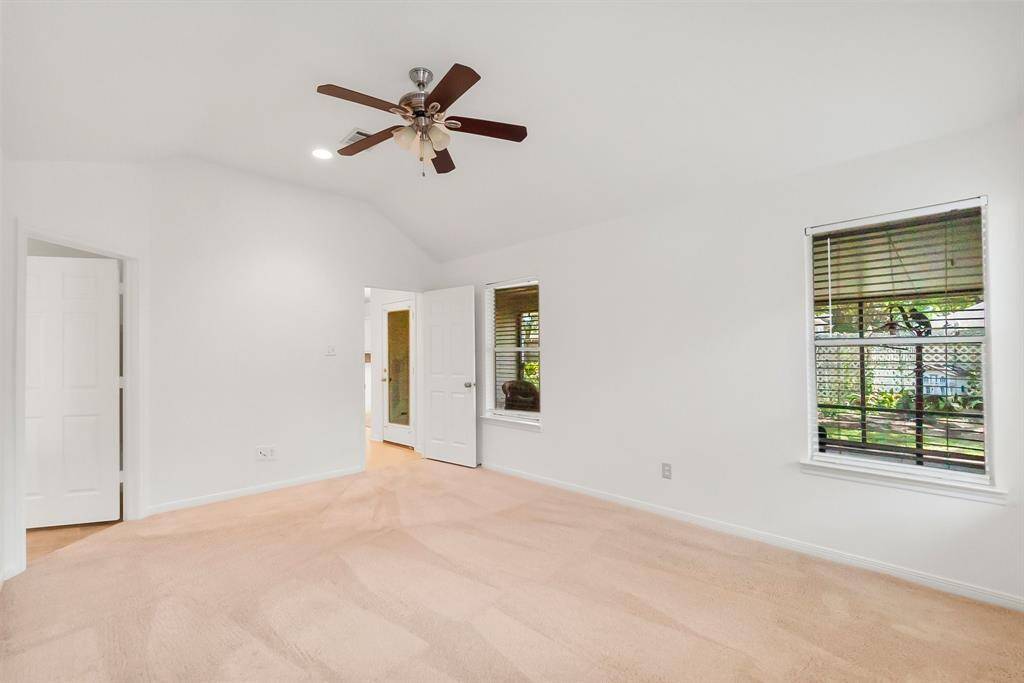 Primary bedroom with windows to porch