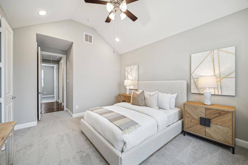 'Alternate view of the primary bedroom with new carpet.