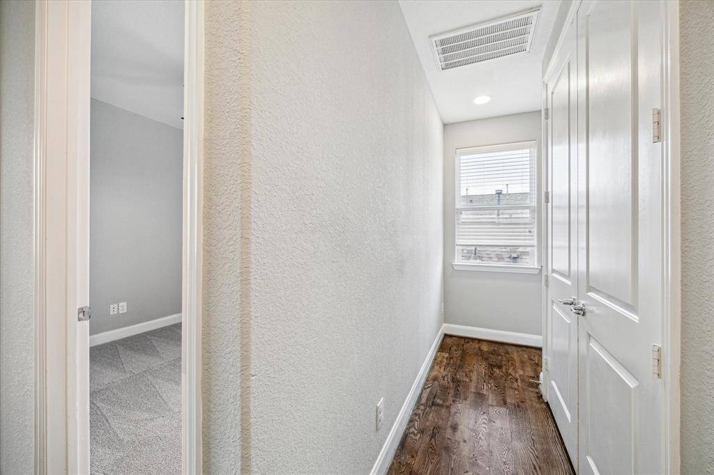The laundry room is conveniently located on the third floor close to the primary and secondary bedrooms.