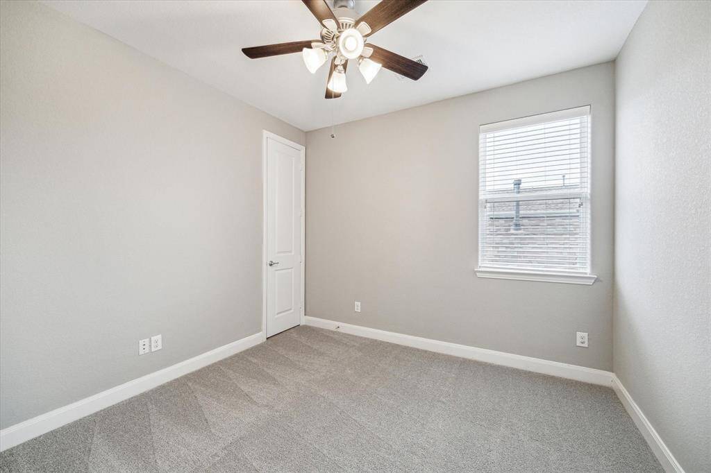 One of two secondary bedrooms on the third floor.