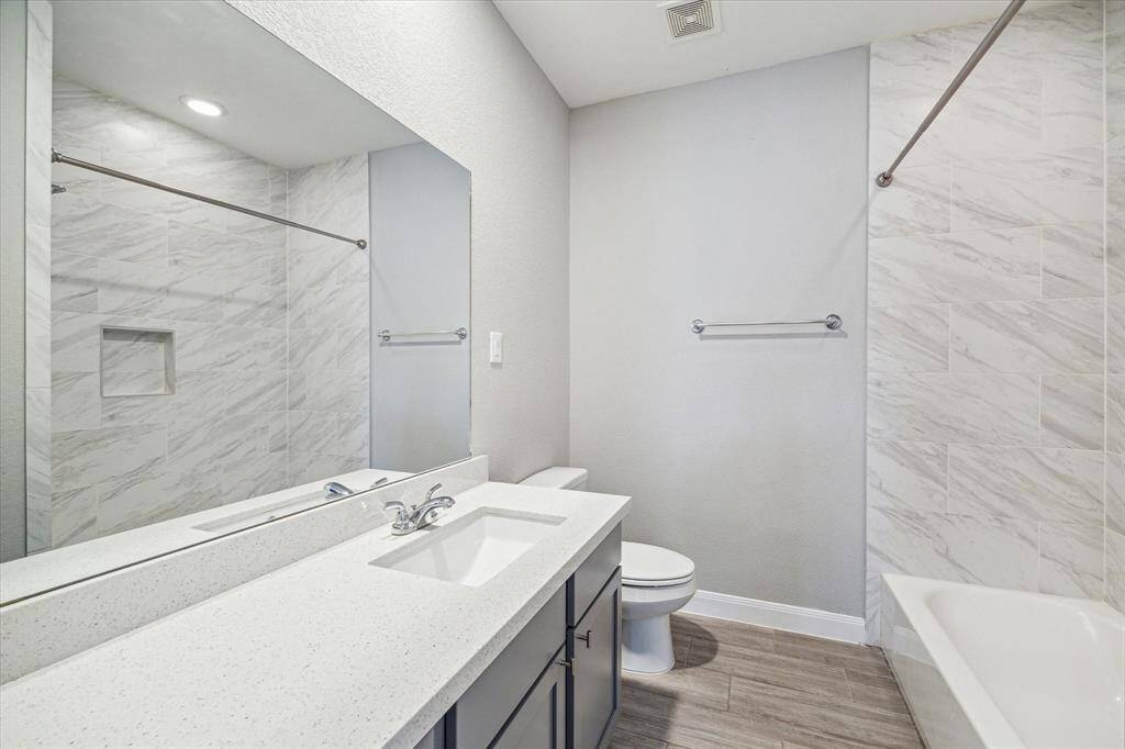 The secondary full bath on the third floor offers a tub/shower combo.
