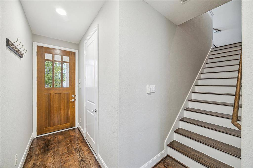 From the first floor you can access the two-car garage and a large bedroom with a full ensuite bathroom with a walk-in closet.