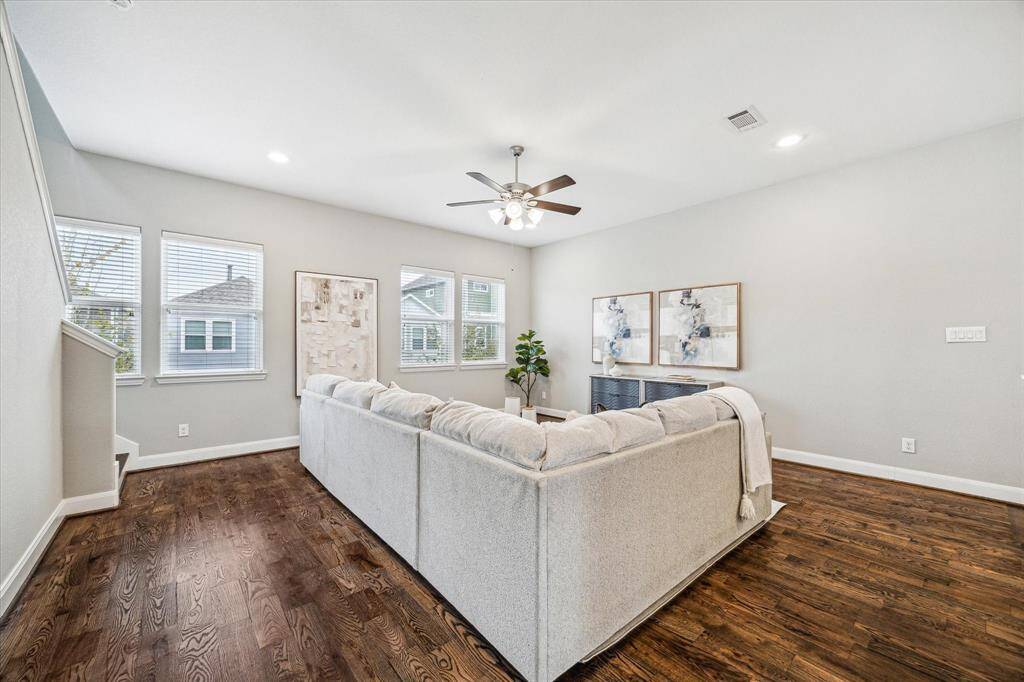 Alternate view of the living room with abundance of natural light.