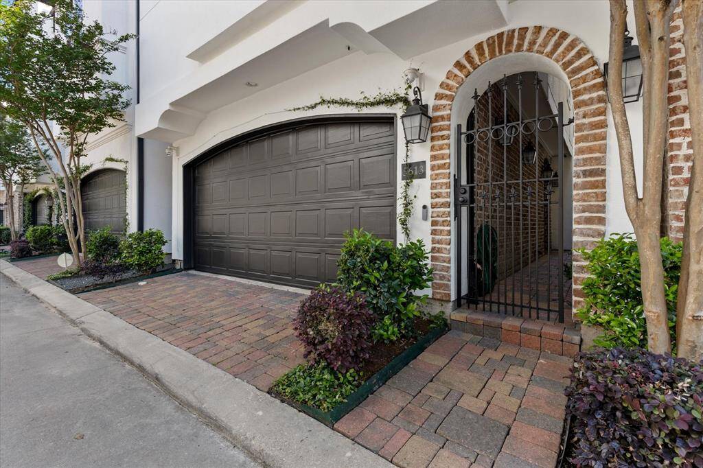 2-car garage and gated walkway provides privacy and convenience.