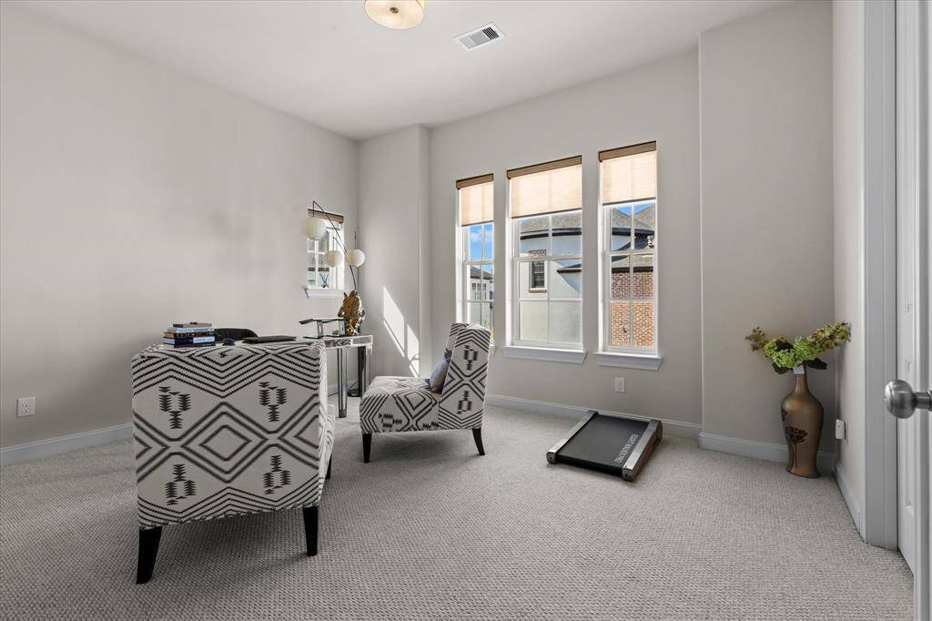 Third floor secondary bedroom currently used for office space.