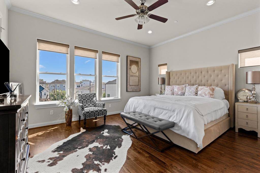 Primary suite flooded with natural light and scenic views.
