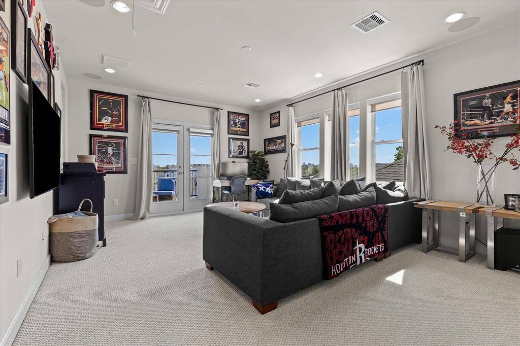 Fourth floor functions as a bedroom with door, closet and private bathroom.