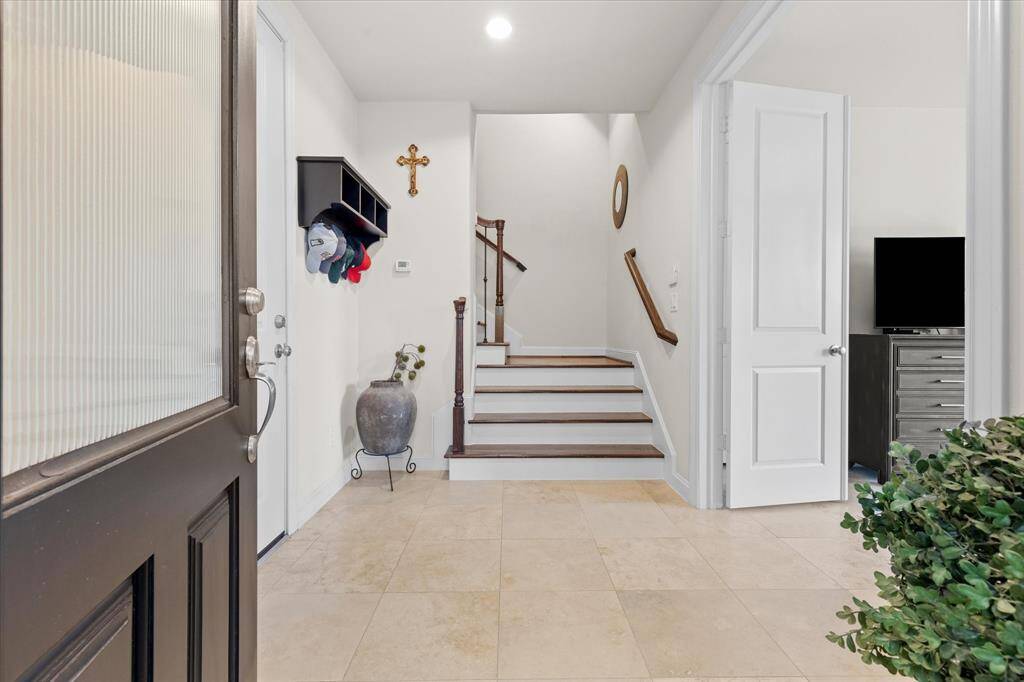 Grand entry from front door for guests, or garage access for homewoner.