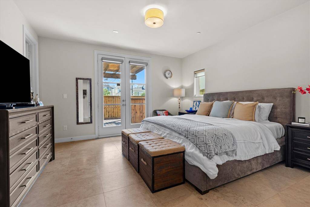 Large guest suite with access to private deck and pergola.