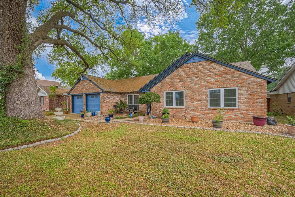 Welcome to 5622 Sheraton Oaks Drive—this classic brick home sits beneath a stunning mature oak and features bold navy accents, a two-car garage, and timeless charm. Located in Houston’s historic Acres Homes community, you’ll love the quiet street, established neighborhood feel, and unbeatable curb appeal.