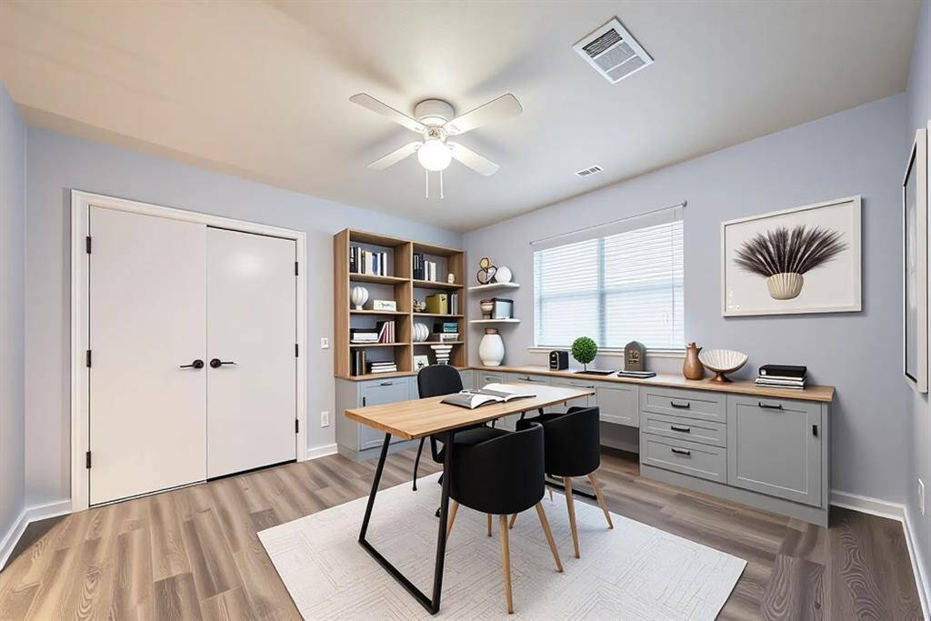 This versatile fourth bedroom has been virtually staged as a stylish home office, showcasing built-in cabinetry, generous desk space, and sleek open shelving. With soft natural light and calming tones, it’s the perfect setup for remote work, creative projects, or a peaceful study zone—proof that productivity can look this good.
