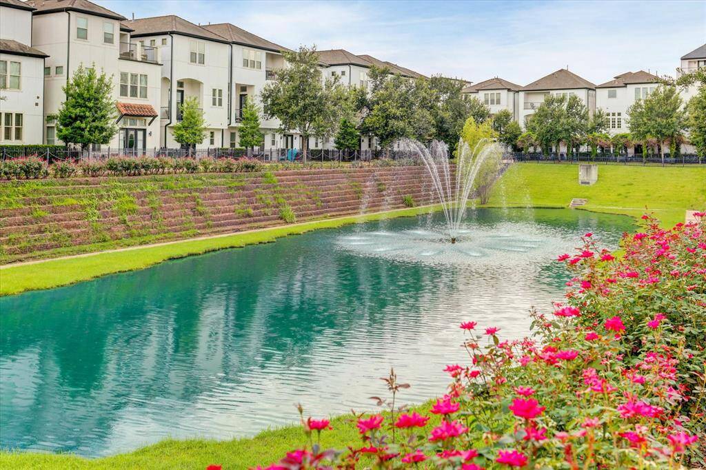 Beautiful view of pond and fountain with pretty landscaping surround