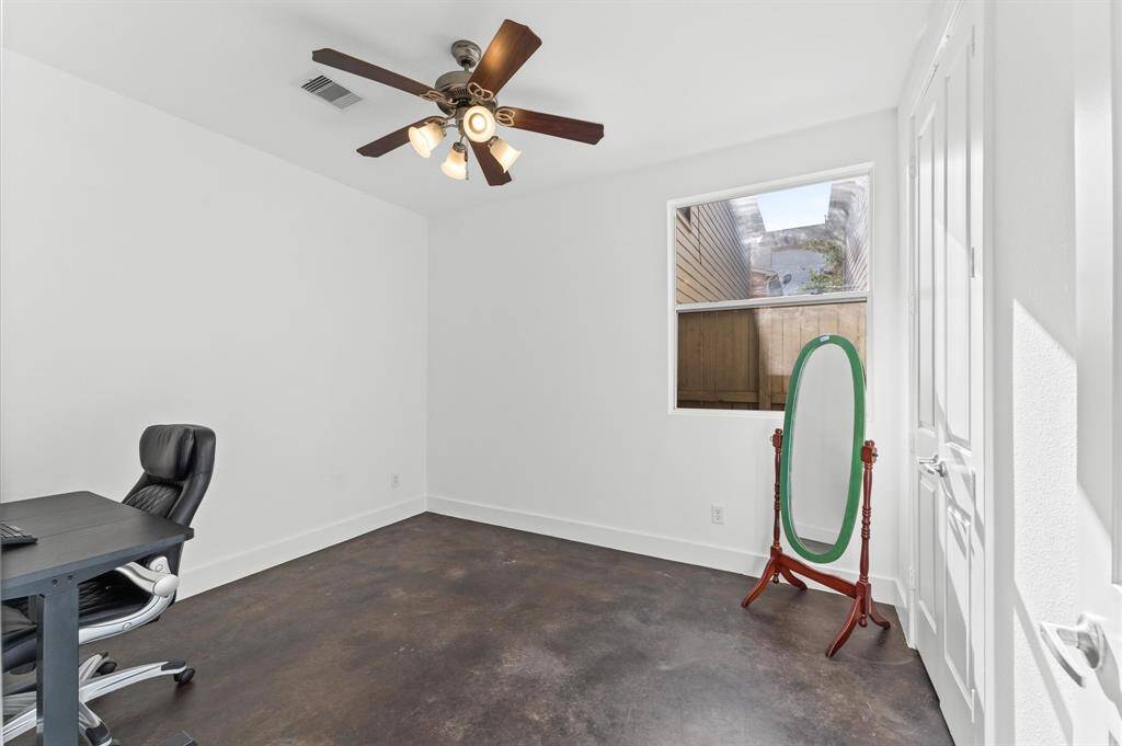 Versatile first-floor bedroom with designated bath—perfect as a private office, guest suite, or flexible work-from-home space.