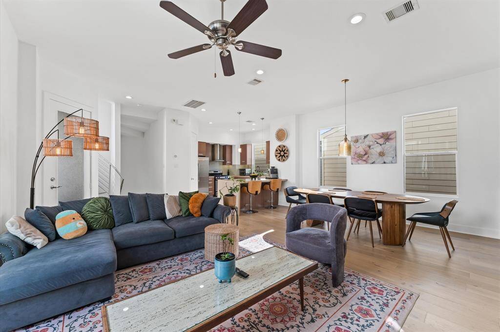 Bright and spacious living area with modern furnishings, large windows, and an open-concept layout—ideal for relaxing or entertaining.