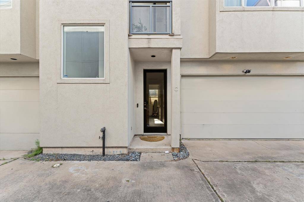 Charming front entry with clean architectural lines and smart keyless access—offering both style and security as you arrive home.