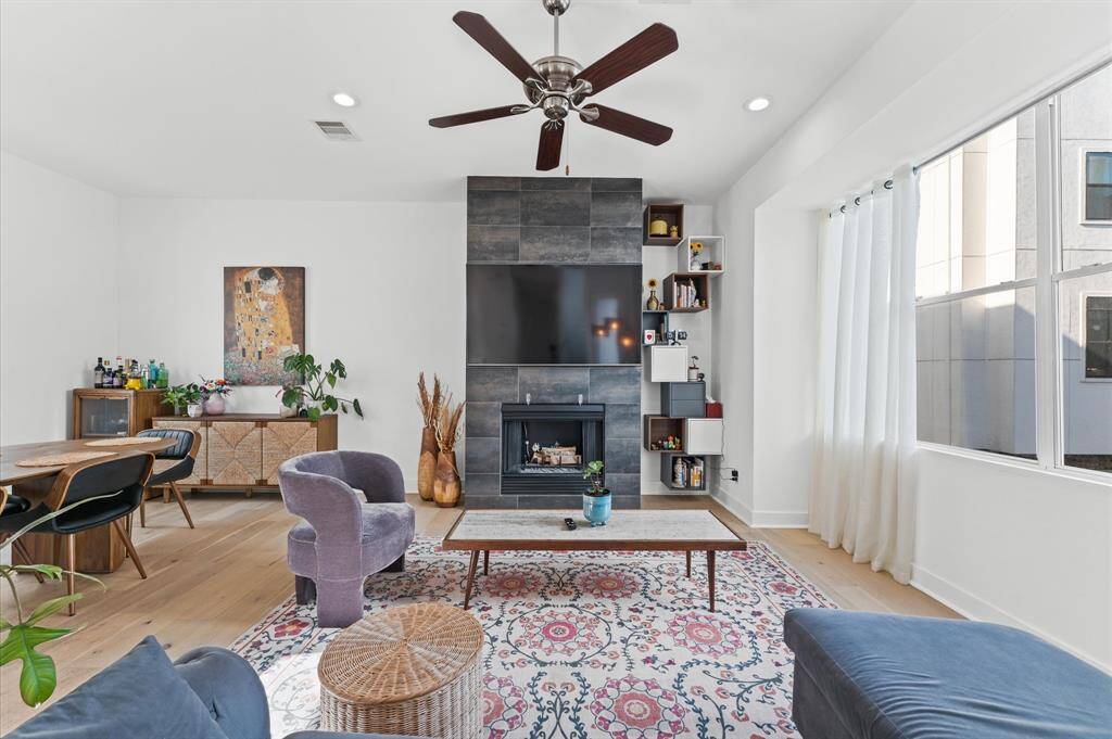 Bright and spacious living area with modern furnishings, large windows, and an open-concept layout—ideal for relaxing or entertaining.