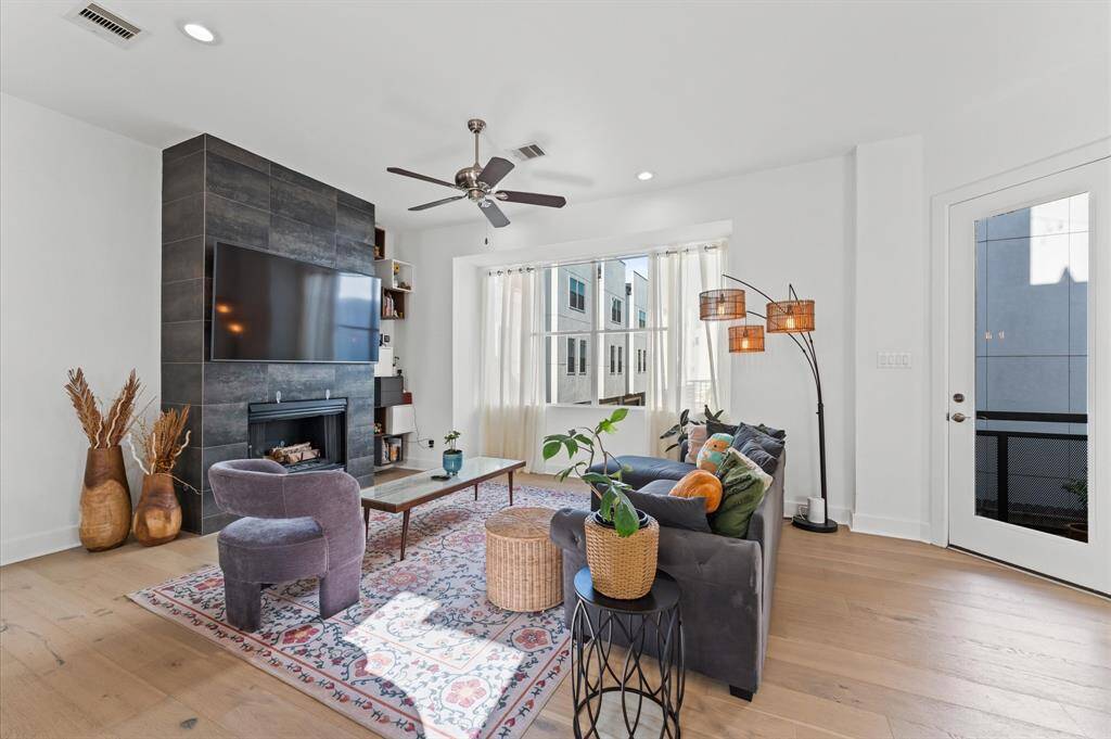 Bright and spacious living area with modern furnishings, large windows, and an open-concept layout—ideal for relaxing or entertaining.
