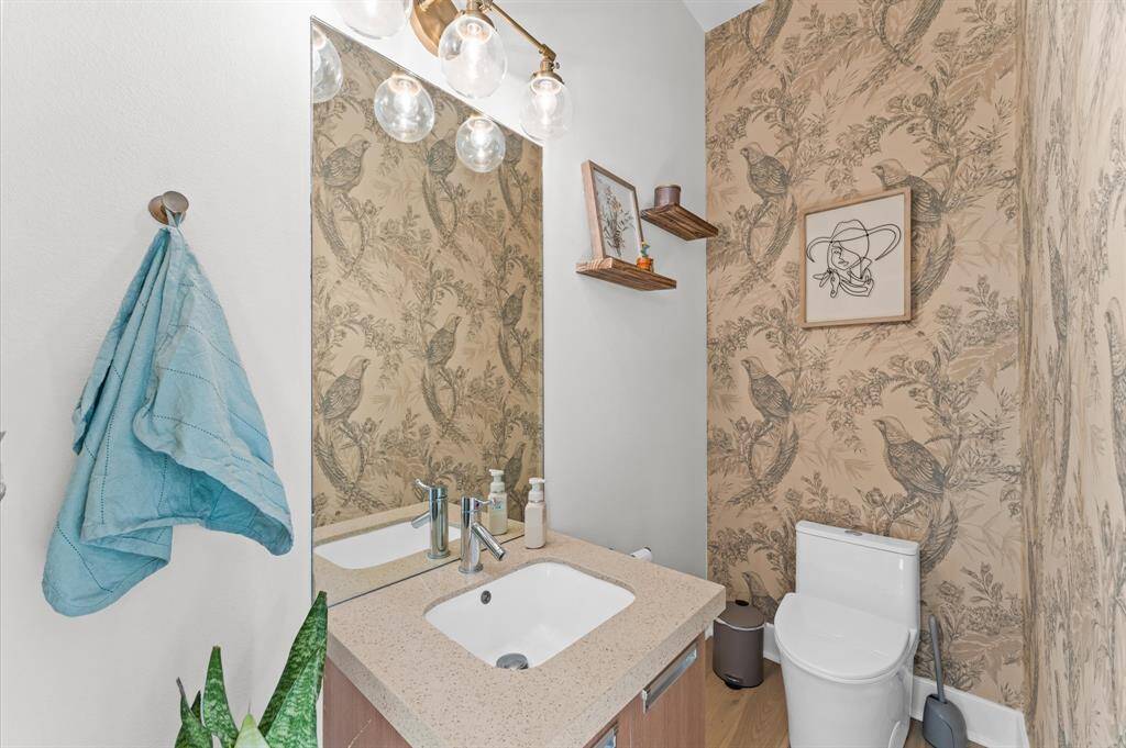 Conveniently located half bath on the main living level—elegantly designed with modern finishes and easily accessible for guests.