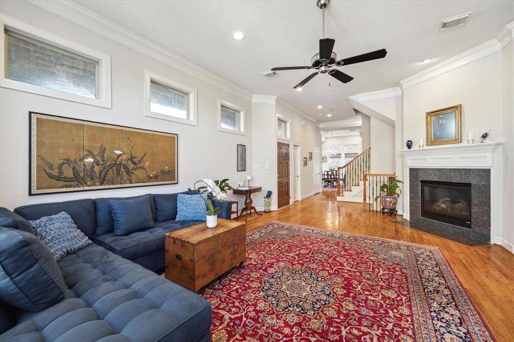 Cozy townhome living area off of the entry on2nd floor, with gas fireplace and lots of natural light.