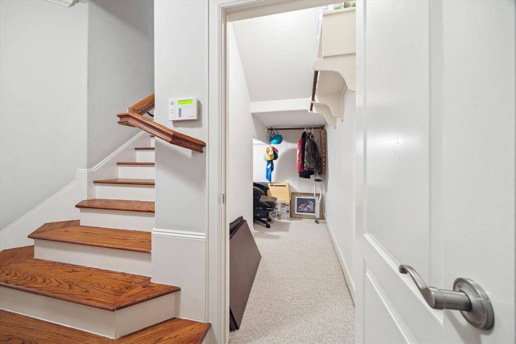 Stairs leading from second floor to first floor.  Huge walk-in storage closet on 1st floor.