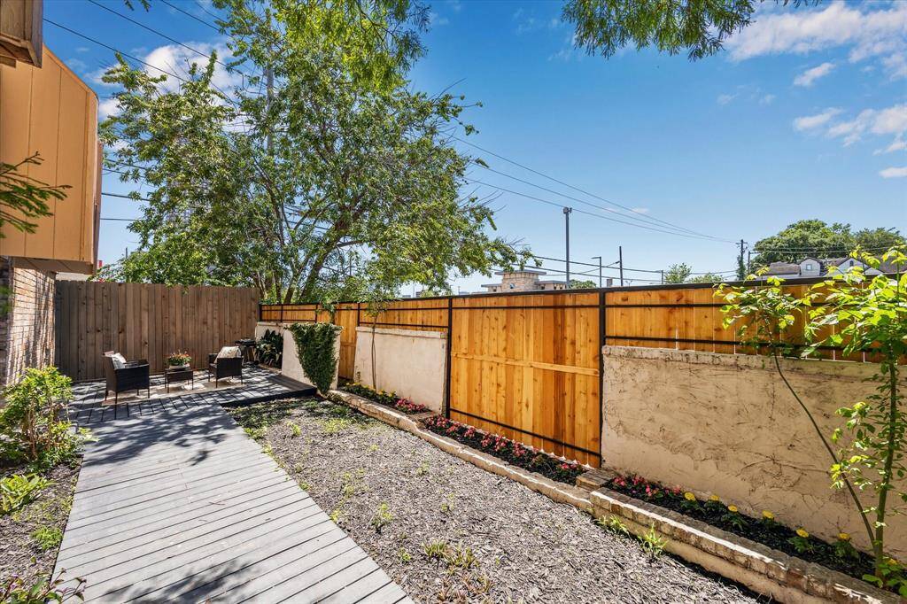 Privacy gates to spacious patio. This space could be used for yard space or entertaining.