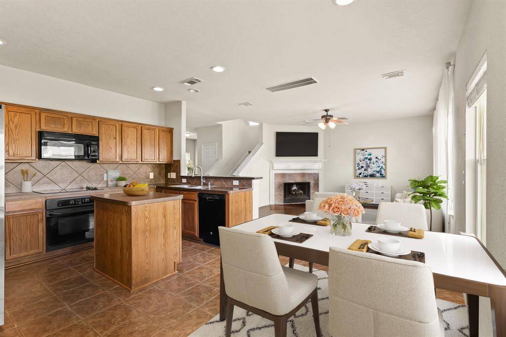 Virtually Staged: Fantastic open layout between the living, kitchen, and dining areas.