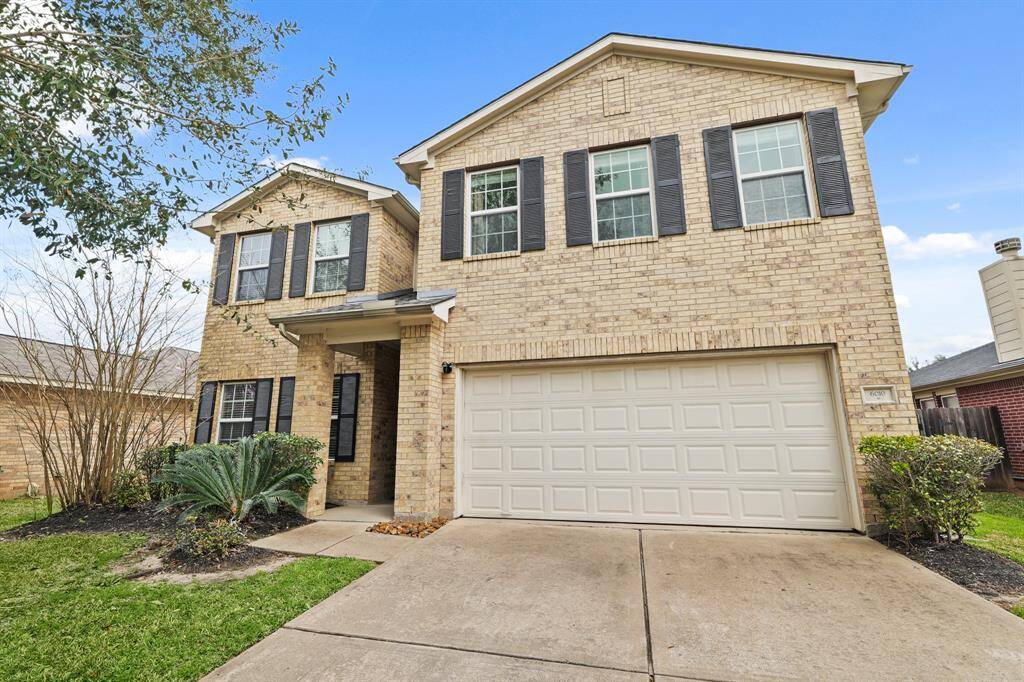 This captivating home boasts a grand curbside appeal and arrival experience - highlighting a beautiful brick and stone elevation.