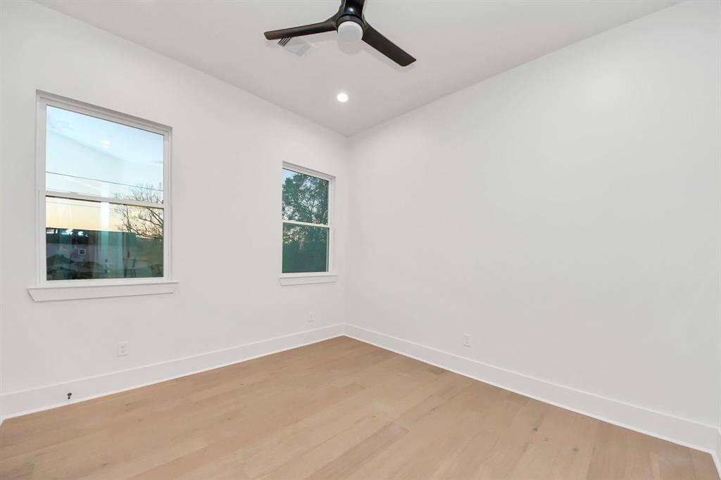 Bedroom 2, windows provide ample natural light to brighten the area.