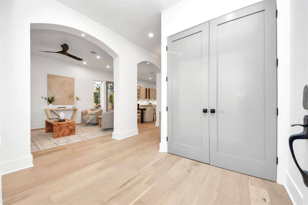 Double doors reveal a front entry closet, with captivating archways that lead you into the living room.