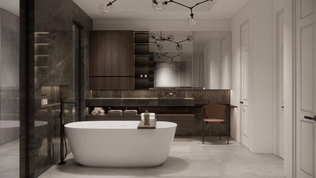 Primary ensuite bathroom with a standalone tub, walk-in shower, dark marble accents, and elegant lighting fixtures. A vanity with plenty of mirror space and the perfect lighting.( These are renderings of the home)