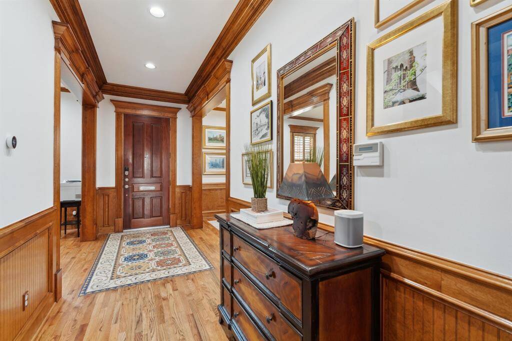 The entry sets a warm tone with its millwork and trim details, inviting you further into the heart of the home.