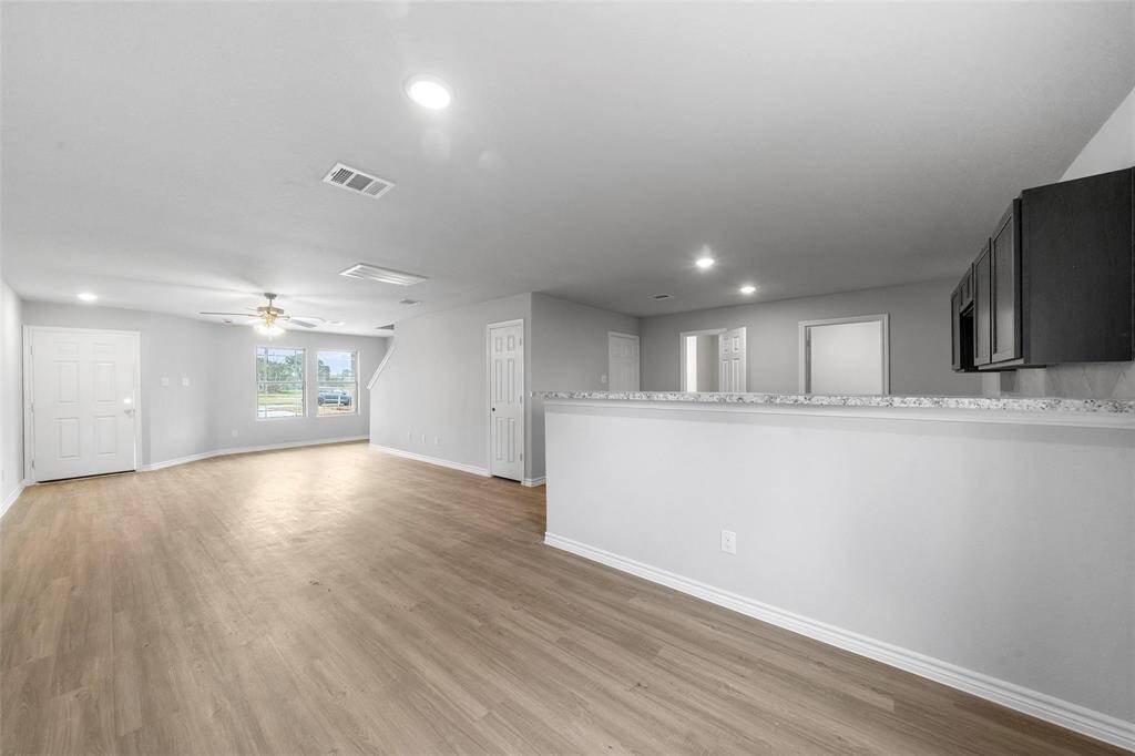 Ideal for everyday meals or gatherings, the dining area flows beautifully from the kitchen and living room.